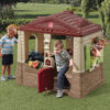 Step2 Neat & Tidy Cottage II Brown Playhouse for Kids – Outdoor Plastic Toy with Dutch Door & Kitchen Setup